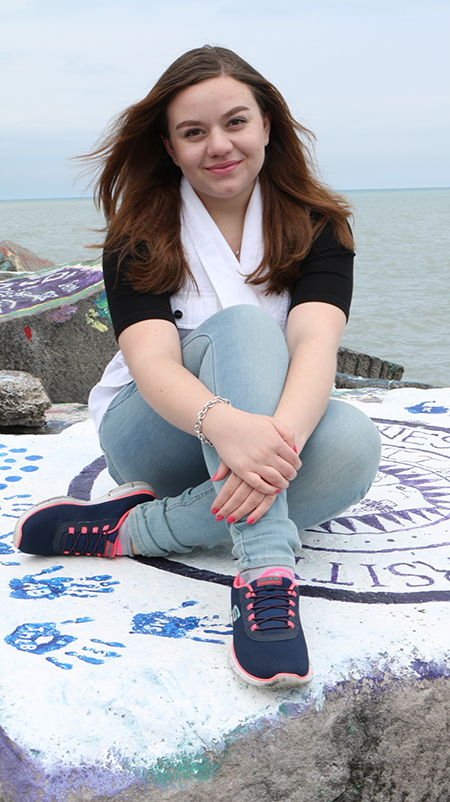 NU-Q student Amanda Melhem sits by Lake Michigan.